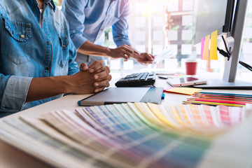 designer graphic creative creativity working together coloring using graphics tablet and a stylus...