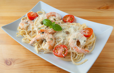 delicious green tagliatelle isolated on white