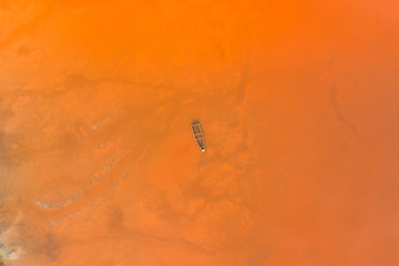 Aerial view of the Pink Lake Retba or Lac Rose in Senegal. Photo made by drone from above. Africa Natural Landscape.