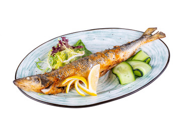 Fried sibas with lemon and fresh cucumbers with lettuce leaves