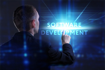 Business, Technology, Internet and network concept. Young businessman working on a virtual screen of the future and sees the inscription: Software development