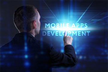 Business, Technology, Internet and network concept. Young businessman working on a virtual screen of the future and sees the inscription: Mobile apps development