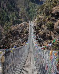 Bridge Crossing with Prayer Flags in Nepal
