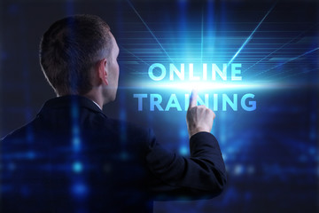 Business, Technology, Internet and network concept. Young businessman working on a virtual screen of the future and sees the inscription: Online training