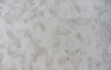 beautiful background from texture closeup decorative venetian stucco on the wall surface gray