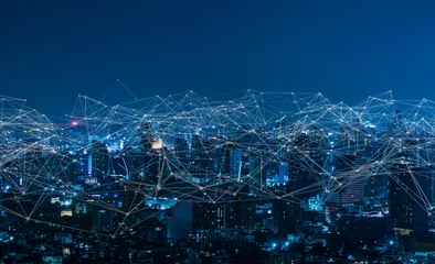 Foto op Canvas Modern city with wireless network connection and city scape concept.Wireless network and Connection technology concept with city background at night. © Yingyaipumi