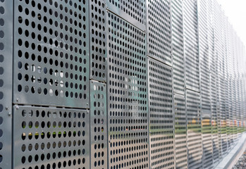 modern materials in the construction industry. Texture of metal cladding of a building facade closeup.