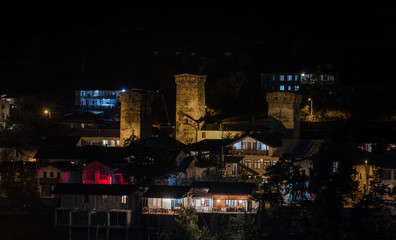 Night  panoramic view of the village of Mestia in Svaneti and the illuminated watchtowers - Koshki in the mountainous part of Georgia