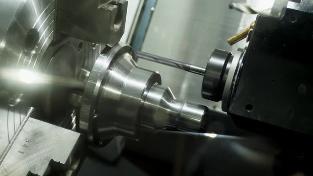 Closeup of robotic automated drilling. Industrial engineering concept.