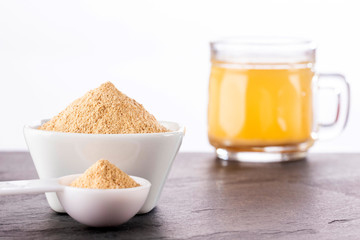 Lepidium meyenii - Powder and maca root drink in a glass