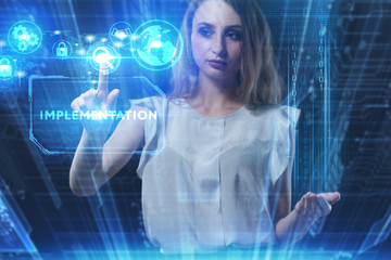 Business, Technology, Internet and network concept. Young businessman working on a virtual screen of the future and sees the inscription: Implementation