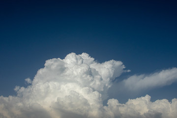 Clouds in the blue sky. Blossom, floor.