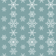 Winter seamless pattern with flat white snowflakes on aquamarine blue background