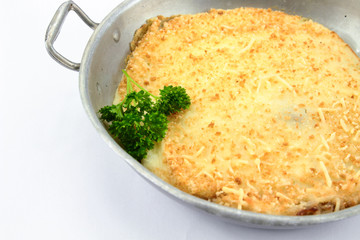 Dish of hachis parmentier on white background