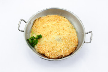 Dish of hachis parmentier on white background