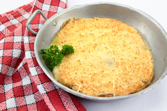 Dish of hachis parmentier on white background