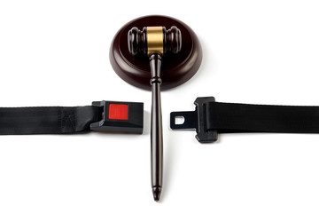 Traffic Laws concept with car seat belt and Judge's gavel