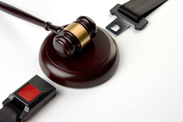 Traffic Laws concept with car seat belt and Judge's gavel