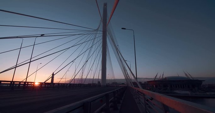 Big Cable-stayed Bridge in the rays of the warm evening sunset impresses with its size and beauty. New stylish expressway Western Speed Diameter in St. Petersburg