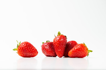 Fresh strawberries were placed on a white background. Copy space.