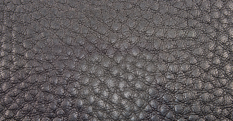 Сlose-up texture of black, genuine leath.
