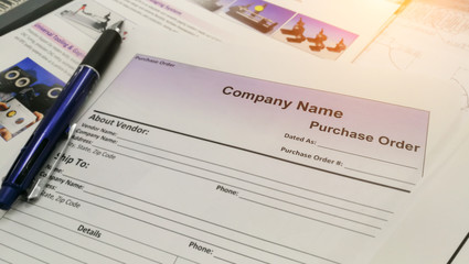 Fill in the purchase items in an order form,Close up of purchase order form with pen / selective focus