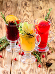 three glasses mulled wine on a rustic wooden table copy space background