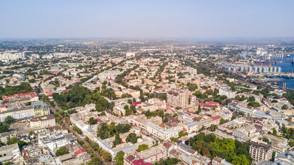 Fototapeta na wymiar Aerial view to Odessa, roofs, port and sea from above