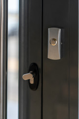 safety in residential buildings. metal door open button close up