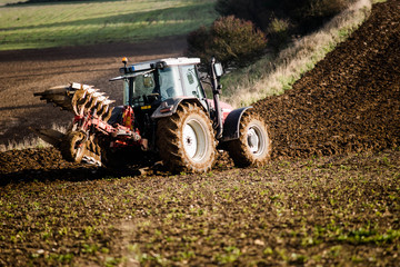 farmer plowing his fields in autumn