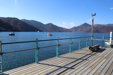 wooden deck with lake view in the background