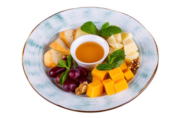 Cheese plate with fruit and nuts