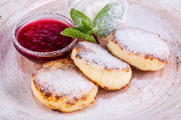 Homemade cheese in sugar powder