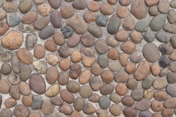 Small grained stone decorated on the cement floor texture background