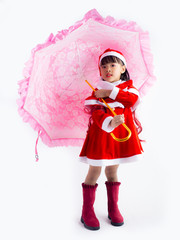 Asian girl is wearing a Santa costume to celebrate Christmas. White background