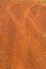 Car tire tracks on a dirt road 
