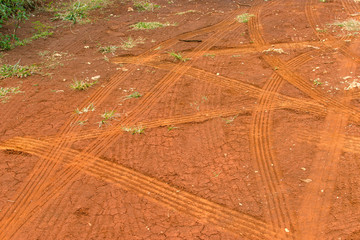 Texture of dirt with car tires tracks 