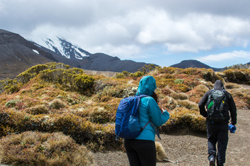 Fototapeta na wymiar Hikers in the mountains in Tongariro national park, New Zealand 