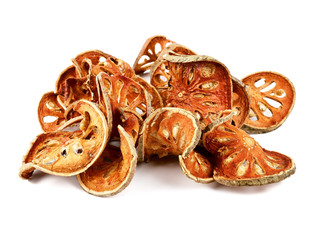 Aegle marmelos. Dry bael fruit isolated on white background.Dried herbs and dried bael fruit drink Healthy and Natural Food concept
