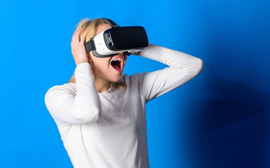 Funny woman experiencing 3D gadget technology - close up. Woman enjoying cyber fun experience in...