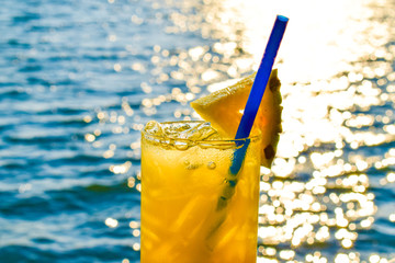 pineapple cocktail glass on the beach