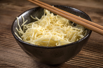 Bowl of cooked noodles.