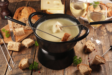 cheese fondue with wine and bread, french winter dish
