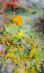 The artist's palette with mixed multicolored colors. Background