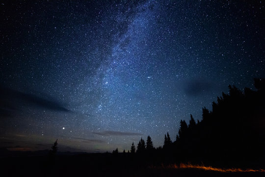 Milky Way Long Exposure Astrophotography Night Sky With Stars Outdoor Scene In Mountains Forrest. Adventure Lifestyle Astronomy Concept. Cosmic Atmosphere Universe Landcape.