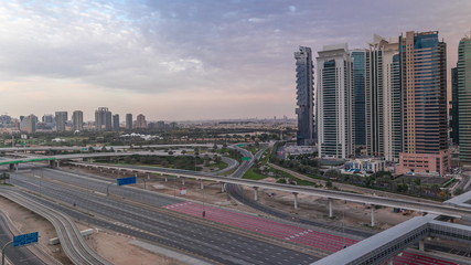Obraz premium Aerial top view to Sheikh Zayed road near Dubai Marina and JLT timelapse, Dubai.