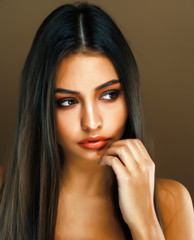 cute happy young indian woman in studio closeup smiling, fashion beauty