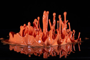 orange paint splash on a black background