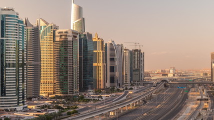 Naklejka na ściany i meble Aerial top view to Sheikh Zayed road near Dubai Marina and JLT timelapse, Dubai.
