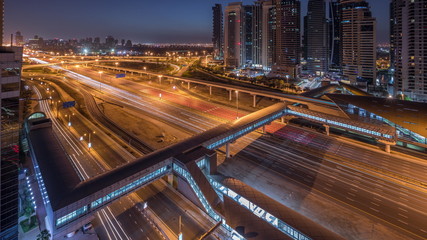 Fototapeta na wymiar Aerial top view to Sheikh Zayed road near Dubai Marina and JLT night to day timelapse, Dubai.
